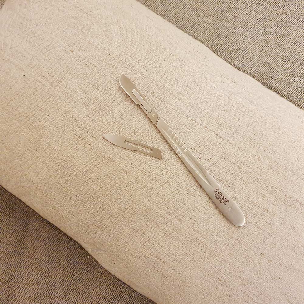 Holder with stainless steel blade